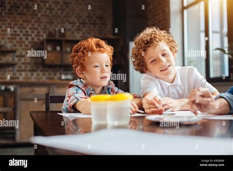 Creative Kids Painting With Watercolors In Kitchen Stock Photo Alamy
