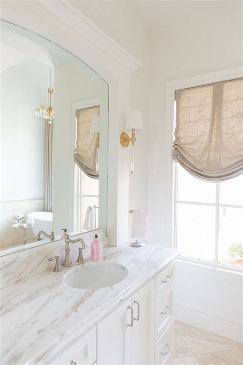 Columns are painted in benjamin moore navajo white. Bathroom white paint color is Sherwin Williams Alabaster ...