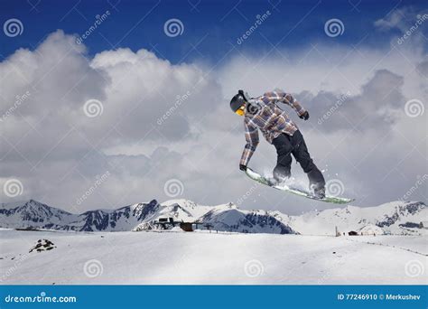 Snowboarder Jumping In Snowy Winter Mountains Stock Photo Image Of