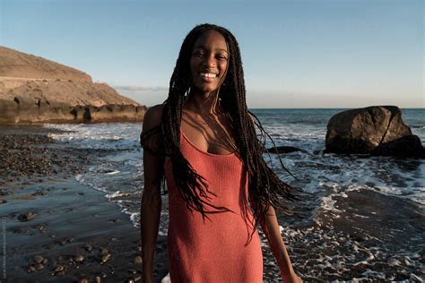 Happy Black Woman On The Beach By Lucas Ottone