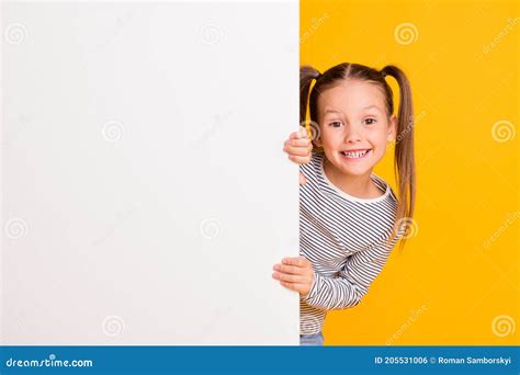 Photo Of Young Happy Smiling Little Girl Child Kid Stand Behind White