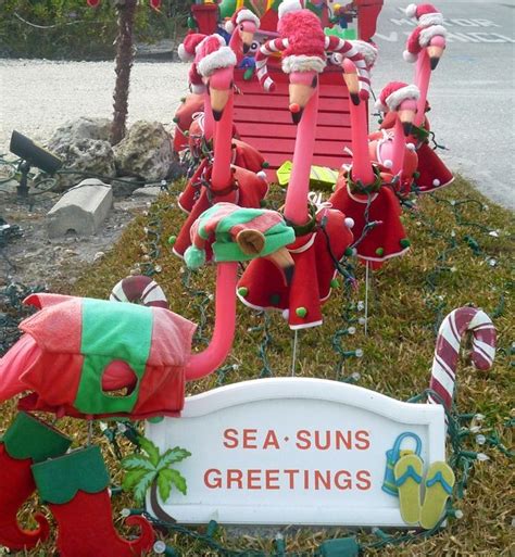 The sanibel ligthhouse is all dressed up for christmas with wreaths and big red bows bringing festivity to the salty air. Pink Flamingo Christmas on Sanibel Island, Florida ...