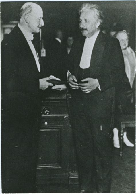 Albert Einstein Receiving The Max Planck Medal From Max Planck The