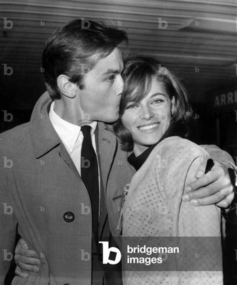 french actor alain delon and his wife nathalie at orly airport when he came back from tokyo on