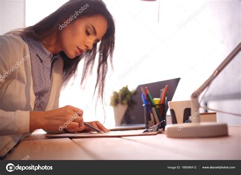 Young Female Working Sitting At A Desk Businesswoman Drawing Student
