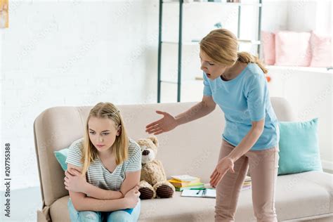 Angry Mother Yelling At Teen Daughter At Home Stock Photo Adobe Stock