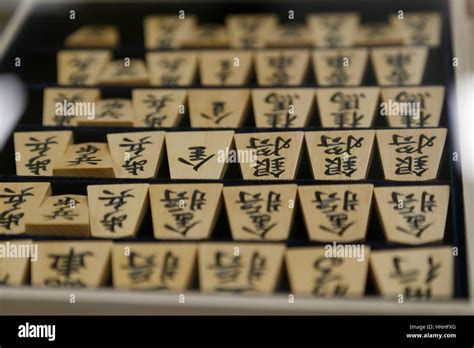 Traditional wooden pieces of Shogi (Japanese chess) on display at the