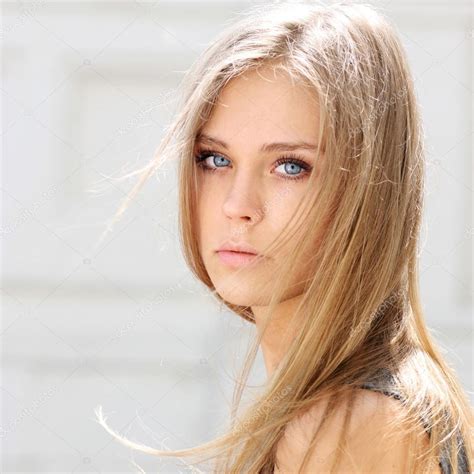 Young Beautiful Blonde Woman Stock Photo By ©arkusha 70039903