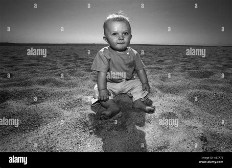Boy Sitting Alone Beach Black And White Stock Photos And Images Alamy