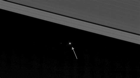 This Photo Of Earth Peeking Out Between Saturns Rings Will Make You