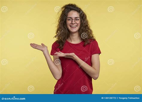A Portrait Shot Of Happy Smiling Brunette Female Showing Palms To