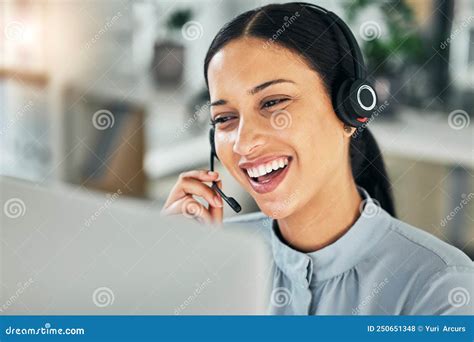 Female Customer Service Representative Using Headset And Consulting
