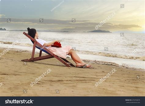 Girl Reading Book Sunbed By Seaside Stock Photo Shutterstock