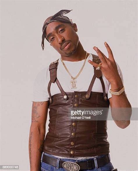 Tupac Holding A Gun