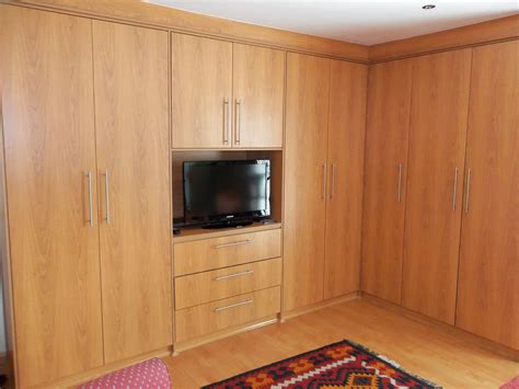 Magnets securely hold the doors closed. bedrooms | Tall cabinet storage, Storage cabinet, Tall storage