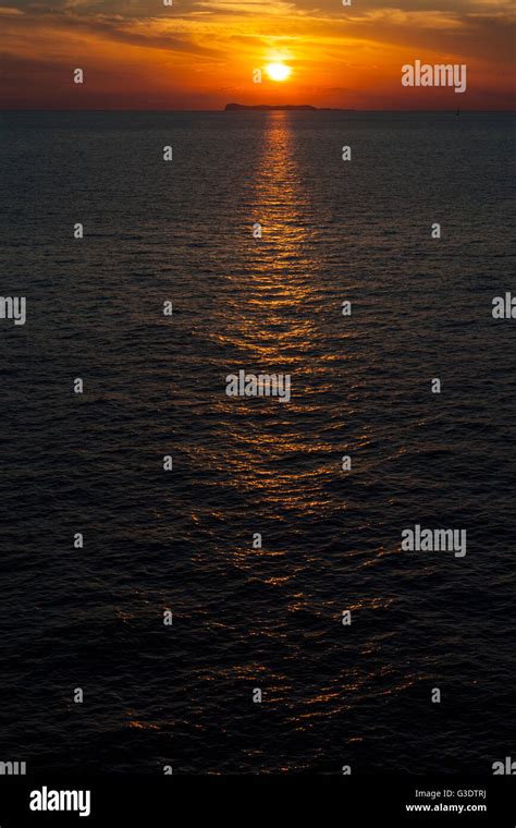 Sunset Reflecting In The Sea Stock Photo Alamy