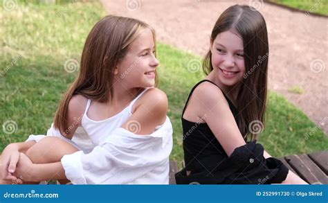 Fraternal Twins Sisters Blonde And Brunette Teen Girls In Fashionable