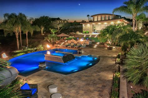 Count on a oasis pool and spa inground pool to deliver more than you ever imagined for your backyard resort. Tropical Pool Oasis With Water Features and Fire Pit ...