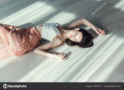 Girl Posing Lying On Floor Stock Photo By Selenittt