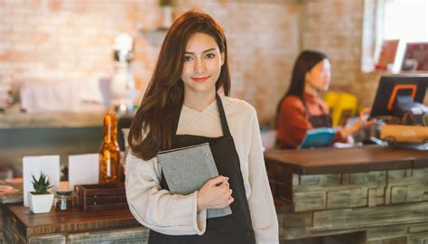 portrait of asian girl waitress loans 2 go