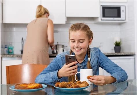 Mother Serving Breakfast To Her Daughter Stock Photo Image Of