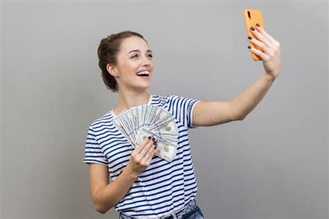 Woman Making Selfie With Money Hiding Face Behind Fan Of Hundred