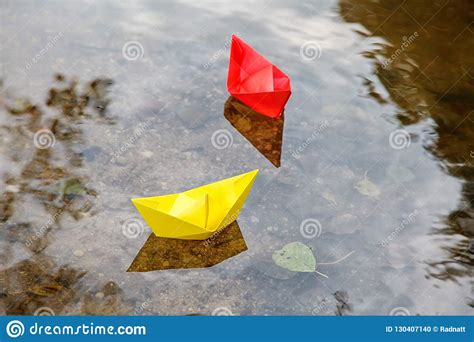 Two Multicolored Paper Boats Floating On A Stream Stock Photo Image