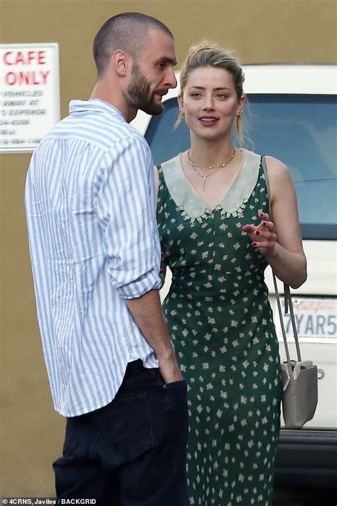 Amber Heard Plants A Kiss On New Beau Andy Muschietti After Allegations