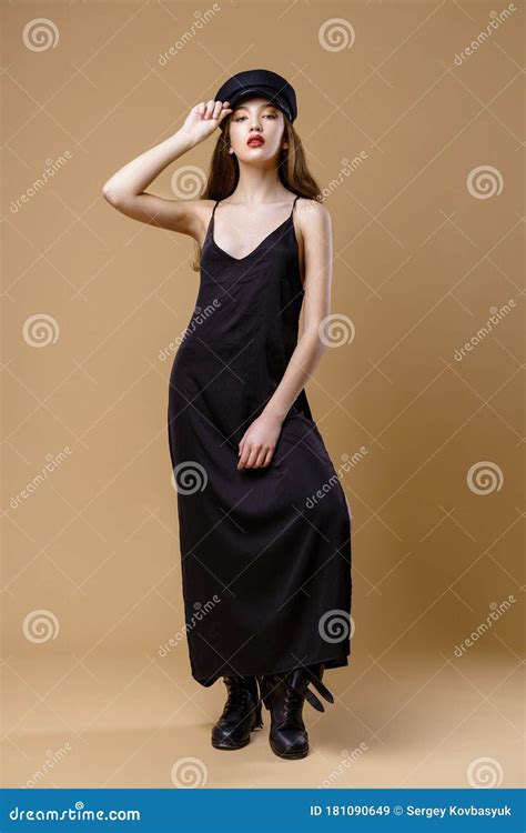 Full Length Portrait Of Gorgeous Young Fashion Model Posing On Studio