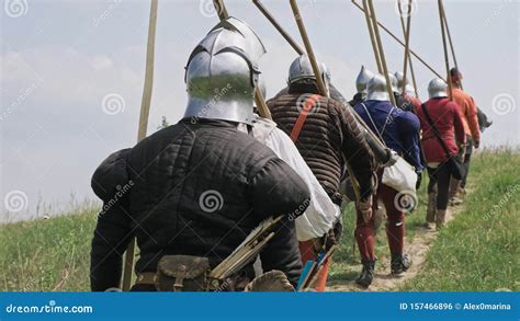 Back View Of Group Medieval Knights Going On The Battle Stock Photo
