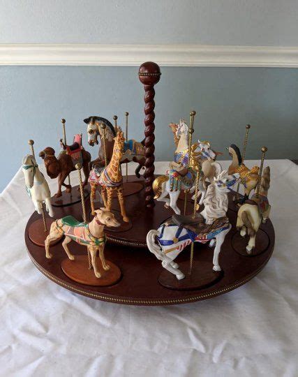 A Wooden Carousel With Many Toy Animals On It