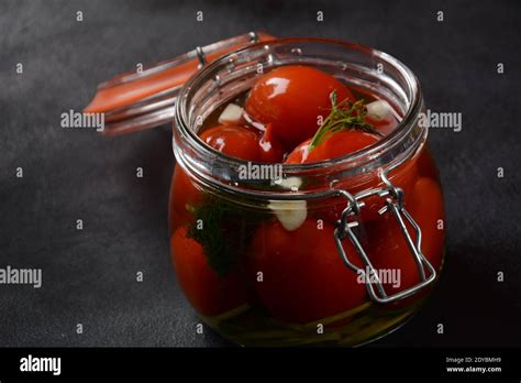 Pickled Cherry Tomatoes In A Glass Jar Stock Photo Alamy