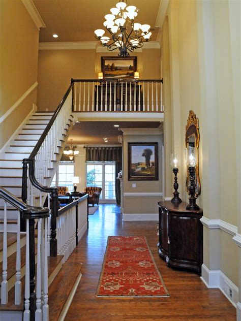 Traditional Two Story Foyer With Large Chandelier And Console Table Hgtv