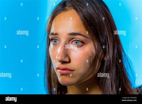 beauty shot of beautiful olive skinned woman light light colored eyes