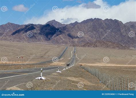Mountains And Grasslands Stretch By Road In Qinghai Stock Image Image