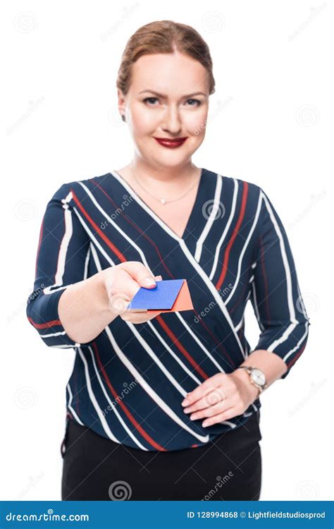 Smiling Businesswoman Giving Red And Yellow Business Cards Stock Photo