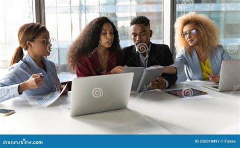 Group Of Concentrated Young African American People Working In Office
