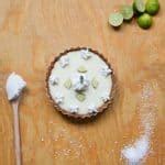Made with wheat, milk, and eggs, this pie has a freshly baked cookie crumble crust filled with whipped creme rosettes. Key Lime Pie Recipe, Vegan, Egg, and Dairy-Free