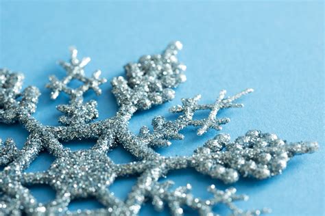 Photo Of Glitter Texture On A Blue Snowflake Decoration Free