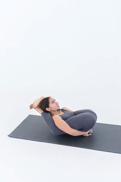 Premium Photo Yoga Woman Doing A Leg Behind Head Pose Lying On Her