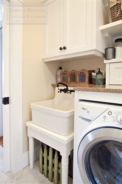 Many small laundry room ideas maximize limited space to fit appliances and supplies. Good Looking Laundry Sinks convention Boston Traditional ...