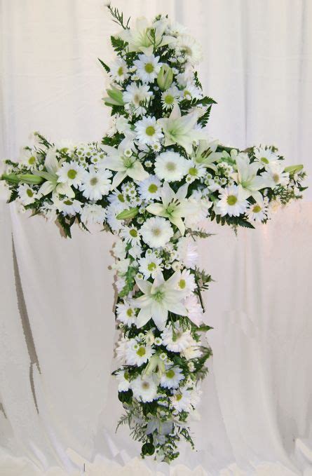 For such occasions relatives usually order various ritual flowers, such as mourning flowers, funeral wreaths, and casket sprays for decorating the coffin. Mixed white cross-beautiful! | Funeral flower arrangements ...