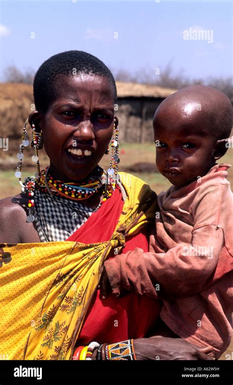 Maasai Tribe Woman With Child In Costume Traditional Dress In Village