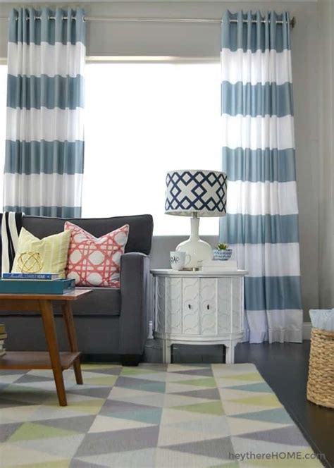 These curtains are very easy to make and the rings are made to snap together over holes you cut in the fabric and then slipped over the curtain rod to hang. Time For New Grommet Curtains - KnockOffDecor.com