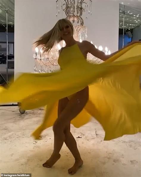Heidi Klum Flashes A Glimpse Of Her Bottom As She Twirls In Yellow Gown Daily Mail Online