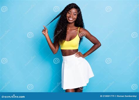 Portrait Of Charming Cheery Wavy Haired Girl Enjoying Touching Curl