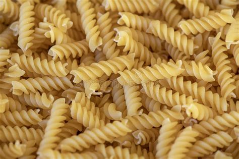 Golden Fusilli Dry Pasta With Its Spiral Shape And Firm Texture A