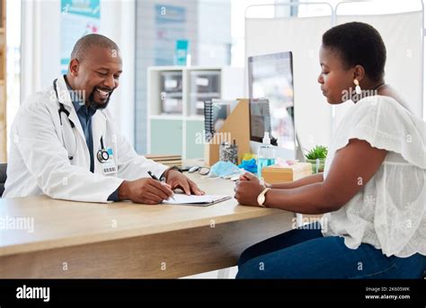 African American Doctor Patient Chart Hi Res Stock Photography And