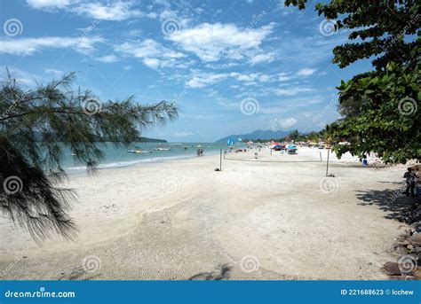 Tourists Enjoying Various Activities Along Pantai Cenang Beach On The