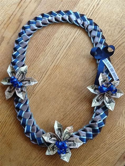 I promise you that this version is a simple, fun, and very doable diy project that you'll actually enjoy doing! Ribbon lei with money flowers. Please check out my page https://www.facebook.com ...